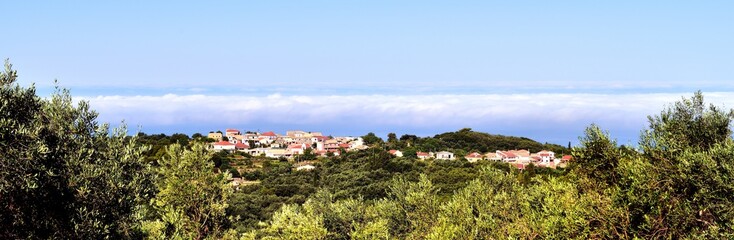 Fototapeta na wymiar Corfu village and morning mist