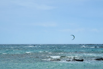CRETE, GREECE - MAY 19, 2019:  tourists enjoy kite on Elafonissi beach on Crete island with azure clear water, Greece, Europe. Crete is the largest and most populous of the Greek islands.