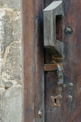 Wood door closed with locks and chain