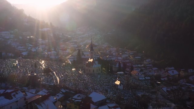 Aerial drone 4k clip of Brasov historical neighborhood Schei at sunset on a beautiful winter day