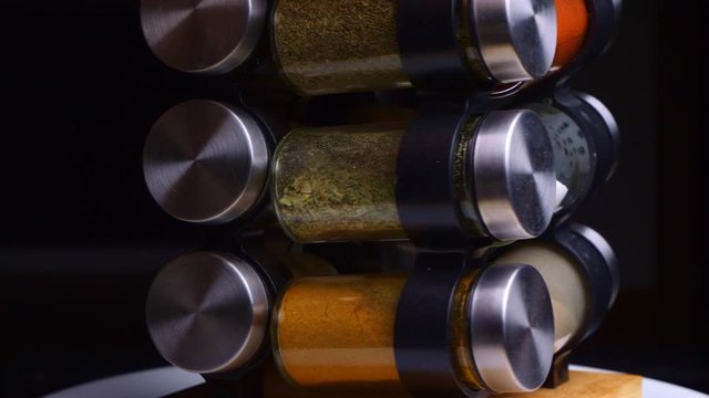 Rotating Set Of Spices And Herbs In Glass Jars Different Colored Mix Cooking Kitchen Closeup Appliance 
