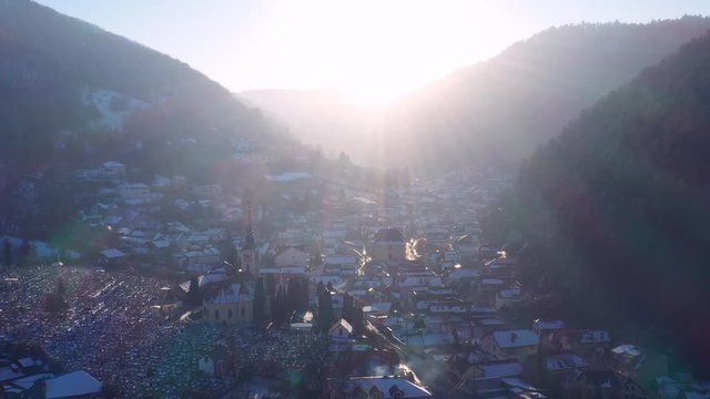 Aerial drone 4k clip of Brasov historical neighborhood Schei at sunset on a beautiful winter day