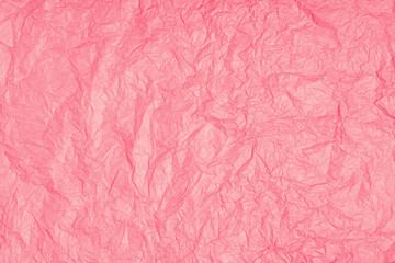 Crumpled pink paper texture. Abstract rose paper background. Flat lay, top view, copy space