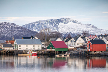 Fototapeta premium Boats and sea house in Brønnøysund harbor in Nordland county 
