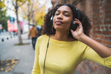 Afro american woman listening music