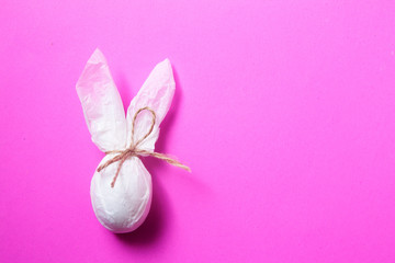 Abstract easter paper rabbit on pink background