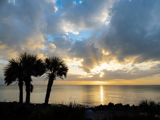 Sun rays in sunset over Gulf of Mexico from Caspersen Beach in Venice Florida