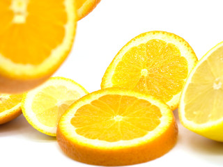 Set of ripe lemon and orange fruits isolated on white background.