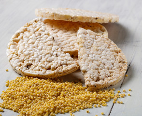 millet bread and millet seeds on a white table