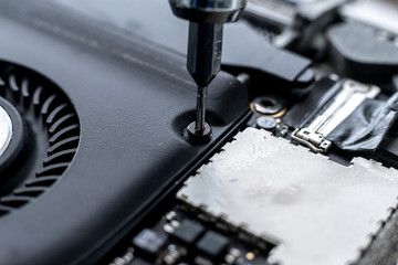 macro view small screwdriver screw and repair the detail inside the computer