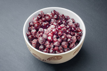 Frozen currants. Frozen berries in a bowl. Organic food. Saving food.