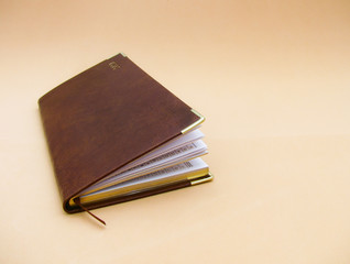 brown planning for 2020 on a beige background. dated diary. notepad