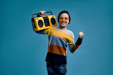 Fashionable boy on a blue background