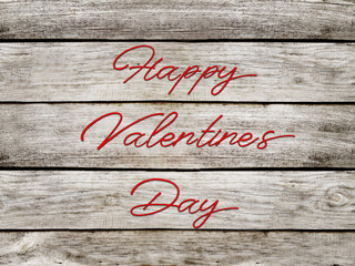 Happy valentines day. Background of wooden boards.