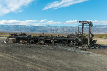 A burned out motor home in the desert