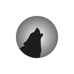 The wolf is howling at the moon.