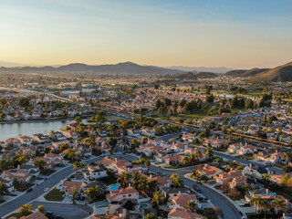 Fototapeta na wymiar Aerial view of Menifee neighborhood, residential subdivision vila during sunset. Riverside County, California, United States