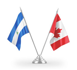 Canada and Nicaragua table flags isolated on white 3D rendering