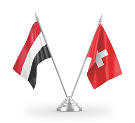 Switzerland and Yemen table flags isolated on white 3D rendering