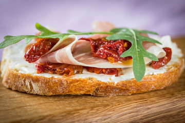 Bruschetta with tomato and basil, bruscetta with salmon and eggs, bruscetta with prosceutto and rucola
