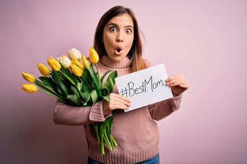 Beautiful woman holding paper with best mom message and tulips celebrating mothers day scared in...