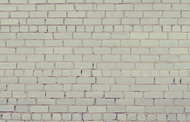 Brick wall in the grunge style. a beautiful background. Selective focus. Special warm treatment