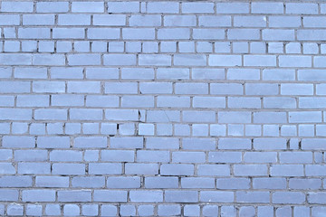 Grey-blue brick wall as background. Brickwork. Old brick wall. Selective focus