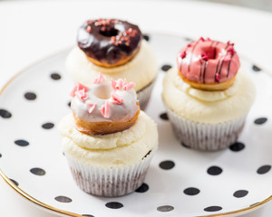 cupcakes with icing and small decorative donuts