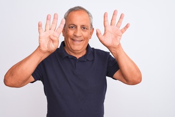 Naklejka premium Senior grey-haired man wearing black casual polo standing over isolated white background showing and pointing up with fingers number nine while smiling confident and happy.