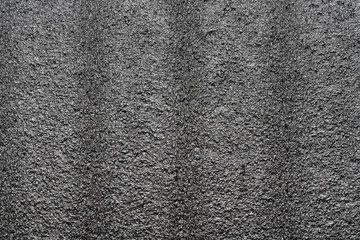 Abstract polystyrene foam background texture. Close-up detail macro photography view of black styrofoam, plastic sheet pattern, polystyrene abstract synthetic packaging material.