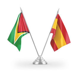 Spain and Guyana table flags isolated on white 3D rendering