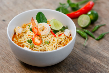 Indonesian noodle menu creations with various additional side dishes.