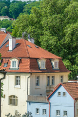 Fototapeta na wymiar Top view to red roofs and blue sky skyline of Prague city Czech republic.