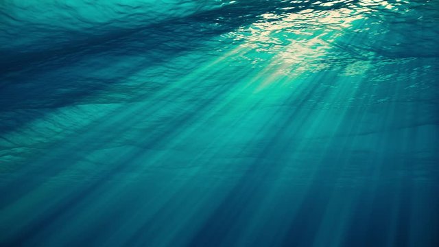 Underwater view with ocean waves flowing in the clear blue water. Beautiful aquatic view with sunbeams shining and creating god rays in the deep sea. 3D animation with swells and tidal waves