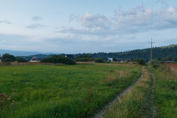 Fototapeta na wymiar road leading to a village in the mountains