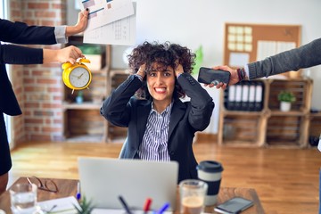 Group of business workers working together. Partners stressing one of them at the office