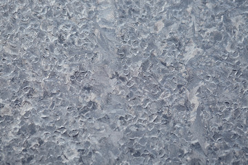 Texture of Frozen drops of condensed steam water drops on the transparent window glass. Clean background. Water vapor condenses on cold window glass and freezes into ice