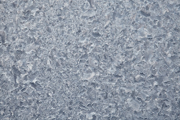 Frozen drops of condensed steam water drops on the transparent window glass. Clean background. Condensation of moisture at extreme temperatures. Water vapor condenses on cold window glass and freezes