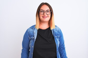 Young beautiful woman wearing denim shirt and glasses over isolated white background with a happy and cool smile on face. Lucky person.