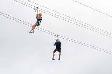 Zip lining from the steepest zip line in the world on the island of St. Maarten.