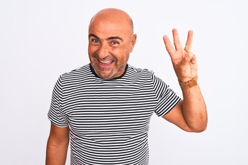 Naklejka premium Middle age handsome man wearing striped navy t-shirt over isolated white background showing and pointing up with fingers number three while smiling confident and happy.