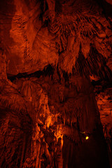 Frozen Niagra formation glows with orange light