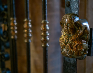 Handle of a gate with artistic statue