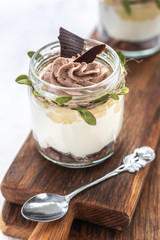 Granola with yoghurt on bright background