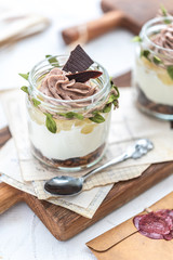 Granola with yoghurt on bright background