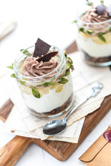 Granola with yoghurt on bright background