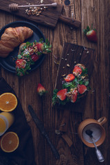 Healthy croissant for breakfast on dark background