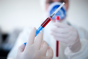 2019-nCoV- Hospital doctor takes blood samples and analyzes dangerous virus.Concept-Coronavirus.-Image
