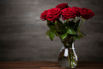 Red roses bunch on the moody background