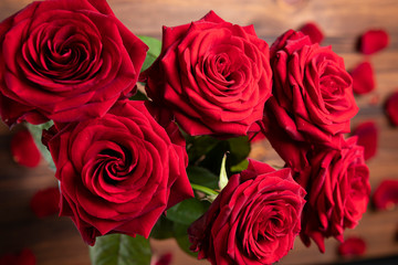 Red roses bunch on the moody background